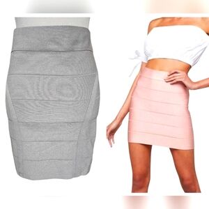 BEBE Metqllic Bondage Mini Skirt In Silver. Size Medium